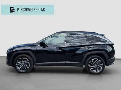 Hyundai Tucson 1.6 TGDI HEV Swiss Edition 4WD — SUV hybride essence, 15 km seulement — côté