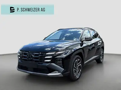 Hyundai Tucson 1.6 TGDI HEV Swiss Edition 4WD — SUV hybride essence, 15 km seulement — vue extérieure