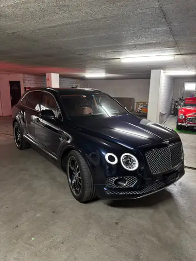Bentley Bentayga W12 — SUV luxe 608 ch, finition Mulliner, combinaison bleu-orange rare — Miniatura 7