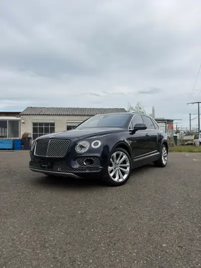 Bentley Bentayga W12 — SUV luxe 608 ch, finition Mulliner, combinaison bleu-orange rare — Miniatura 15