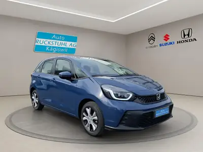 Honda Jazz 1.5 i-MMD Elegance — Hybride léger, consommation ultra-faible et polyvalence urbaine — side view