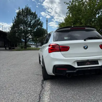 BMW M135i xDrive Steptronic — Berline sportive 326 ch avec kit Maxton et échappement M Performance — rear view
