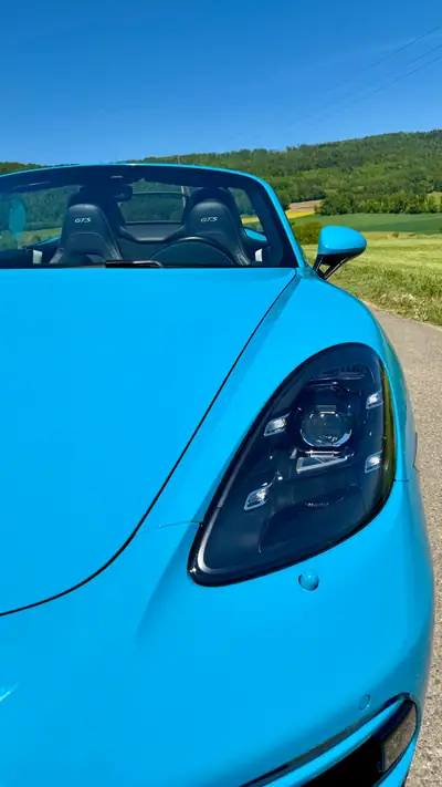 Porsche 718 Boxster GTS 2.5 PDK — Cabriolet sportif Miami Blue, 65'000 km — côté