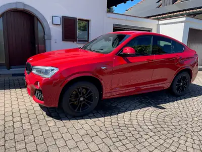 BMW X4 xDrive35i — SUV Coupé sportif, 306 ch et design rouge éclatant — fianco