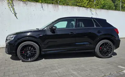 Audi Q2 2.0 TFSI S Line — SUV compact dynamique, 58 000 km, équipements premium — side view