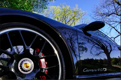 Porsche 911 Carrera 4 GTS — Sportive légendaire, très faible kilométrage — Heckansicht