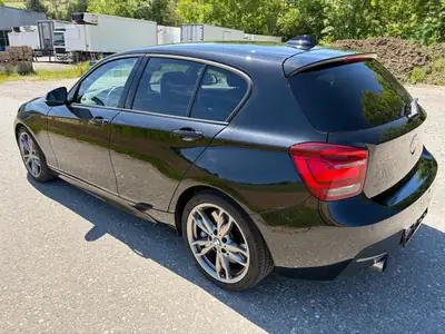 BMW M135i xDrive 2014 — Berline sportive 319 ch, transmission intégrale — côté
