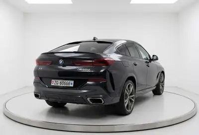 BMW X6 M50d — SUV coupé musclé, 400 ch diesel, équipement complet — vue extérieure