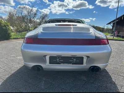 Porsche 911 Carrera 4S 3.6 — Cabriolet légendaire, 320 ch et transmission manuelle — side view