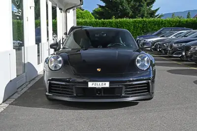 Porsche 911 Carrera 4S PDK — Icône sportive 450 ch, direction arrière et châssis actif — rear view