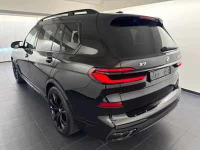 BMW X7 xDrive 48 M60i M Sport Pro — SUV 7 places premium, très faible kilométrage — side view