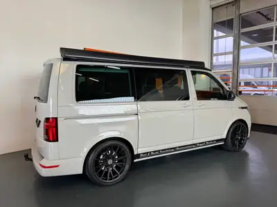 Volkswagen T6.1 California Beach — Camping-car premium, 7000 km, suspension Vossen — side view