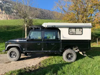 Land Rover Defender 130 2.2 TD4 — Pick-up robuste, 84000 km, diesel fiable — côté