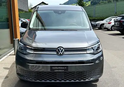 VW Caddy Maxi 1.5 TSI Style — 7 places, attelage et navigation, 42000 km seulement — side view
