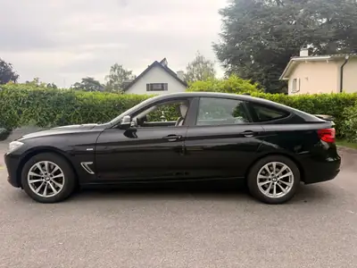 BMW 328 Gran Turismo xDrive — Berline spacieuse, tout-terrain, sièges cuir chauffants — rear view