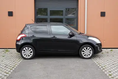 Suzuki Swift 1.2i 16V GL — Citadine robuste 4x4, sièges chauffants et moteur économe — intérieur