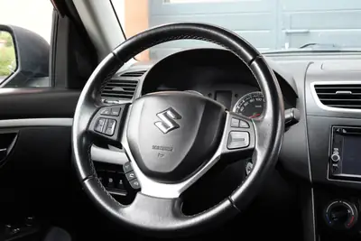 Suzuki Swift 1.2i 16V GL — Citadine robuste 4x4, sièges chauffants et moteur économe — Miniature 12