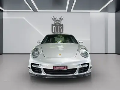 Porsche 911 Turbo 2007 — Légendaire coupé sportif, 480 ch, état impeccable — side view
