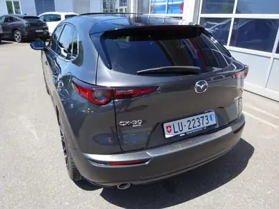 Mazda CX-30 SKYACTIV-X M Hybrid 180 — Compact hybride performant, seulement 48000 km — fianco