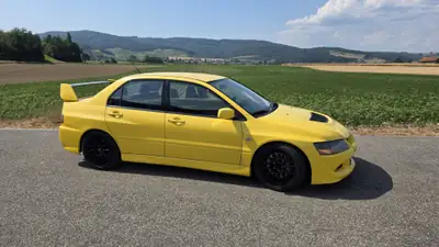 Mitsubishi Lancer Evolution VIII 2.0 T — Légende sportive iconique, historique complet depuis 2009 — arrière