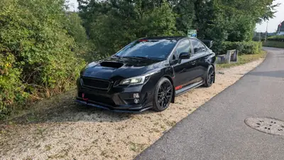 Subaru WRX STI 2014 — Berline sportive 300 ch, tout-terrain, révisée et garantie — side view