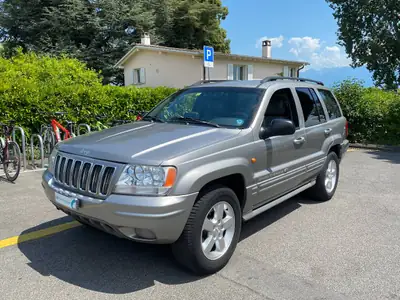 Jeep Grand Cherokee 4.7 Overland — SUV polyvalent, traction intégrale, sièges cuir chauffants — côté