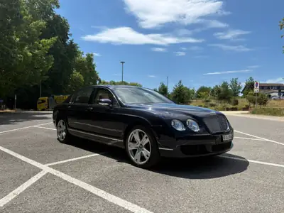 Bentley Continental Flying Spur W12 Bi-Turbos — Berline de prestige 560 ch, kilométrage maîtrisé — side view