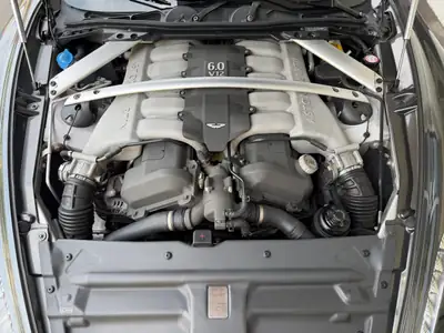 Aston Martin Rapide 5.9 V12 — Gran turismo britannique, 476 ch, intérieur cuir blanc — Miniature 11