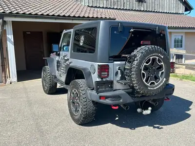 Jeep Wrangler 3.6 V6 Rubicon — Légende 4x4, motorisation musclée et intérieur rouge signature — Seitenansicht