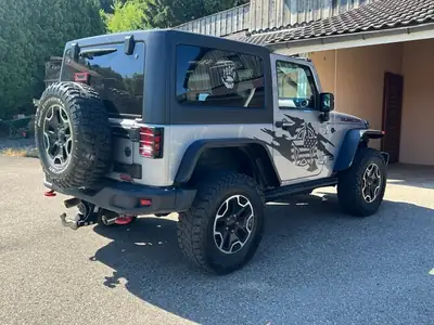 Jeep Wrangler 3.6 V6 Rubicon — Légende 4x4, motorisation musclée et intérieur rouge signature — Heckansicht
