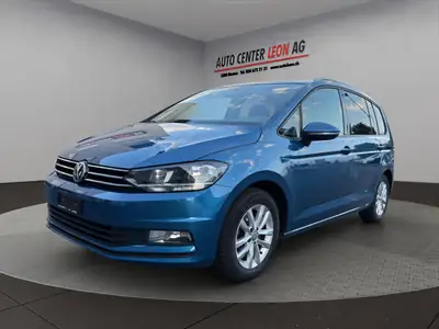 VW Touran 1.4 TSI BlueMotion — Monospace familial fiable, toit panoramique et 8 places — côté