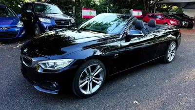BMW 420i Cabriolet Luxury Line — Élégance décapotable, motorisation efficace — côté