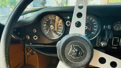 Jaguar E-Type Series 3 V12 Roadster — Chef-d'œuvre britannique, seulement 9'754 km — Miniature 10