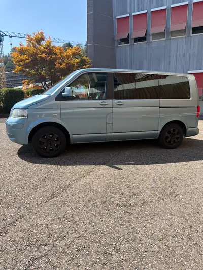 VW T5 Multivan Atlantis 2.5 TDI 4Motion — Monospace 7 places robuste et polyvalent — côté