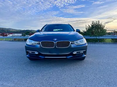 BMW 320i xDrive Touring — Familiale Premium All-Wheel Drive, 140 000 km, Historique complet — side view