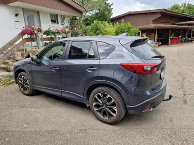 Mazda CX-5 2.2 D Revolution AWD — SUV robuste, tout-terrain, très basse consommation — côté