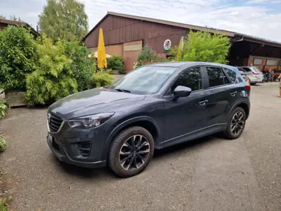 Mazda CX-5 2.2 D Revolution AWD — SUV robuste, tout-terrain, très basse consommation — vue extérieure