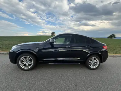 BMW X4 xDrive 35i M Sport — Coupé SUV haute performance, équipement M complet — exterior view