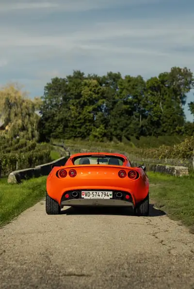Lotus Elise 1.8 16V Racetech 2003 — Roadster légendaire, orange métallisé, faible kilométrage — côté