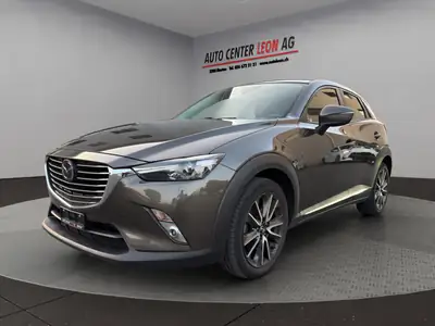 Mazda CX-3 2.0 Revolution AWD — Compact SUV fiable, tout-terrain et bien équipé — côté