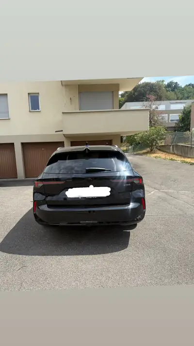 Opel Astra 1.6 T PHEV 180 — Break hybride rechargeable, ultra-économe — rear view