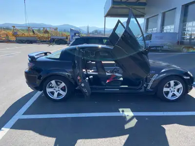 Mazda RX-8 2.6 Revolution 231 — Coupé sportif emblématique, moteur rotatif unique — côté