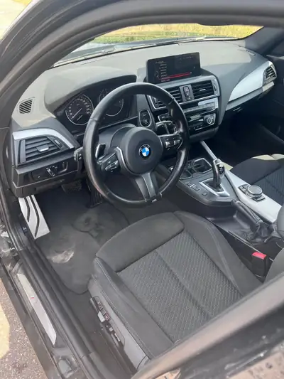 BMW M135i xDrive 2015 — Berline sport haute performance, 326 ch et transmission intégrale — dashboard