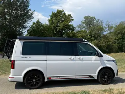 VW T6.1 California Beach Edition — Le camping-car premium 4Motion, véhicule de garage impeccable — côté