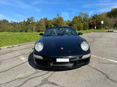 Porsche 911 Carrera 4 Cabriolet — 325 ch, toit ouvert, sans accident — side view
