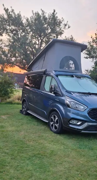 Ford Tourneo Custom 2.0 TDCi 185 Camper — Van aménageable 8 places, parfait état — side view