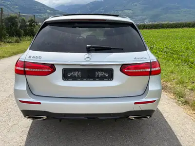 Mercedes-Benz E 400 AMG Line 4Matic — Familiale élégante, 333 ch et transmission intégrale — Heckansicht