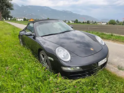 Porsche 911 Carrera 4 Cabriolet — Chef-d'œuvre décapotable, 325 ch et transmission manuelle — Miniatura 11