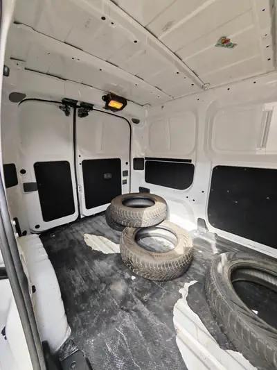 Nissan NV200 1.6 16V Pro — Utilitaire compact polyvalent, 17 500 km seulement — côté