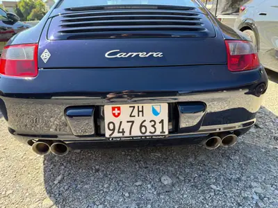 Porsche 911 3.6 Carrera — Coupé mythique, 325 ch et transmission automatique — side view